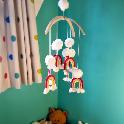 Handmade pom pom rainbow mobile, a colourful boho nursery decor piece and baby gift Australia.