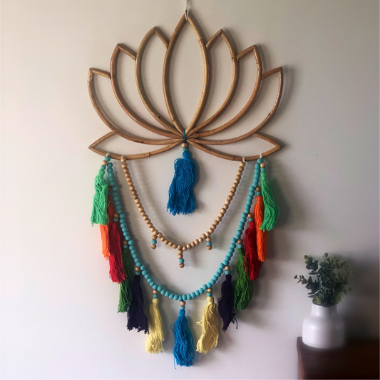 This beautiful design combines beads and tassels falling from a blooming lotus flower. Multi coloured tassels