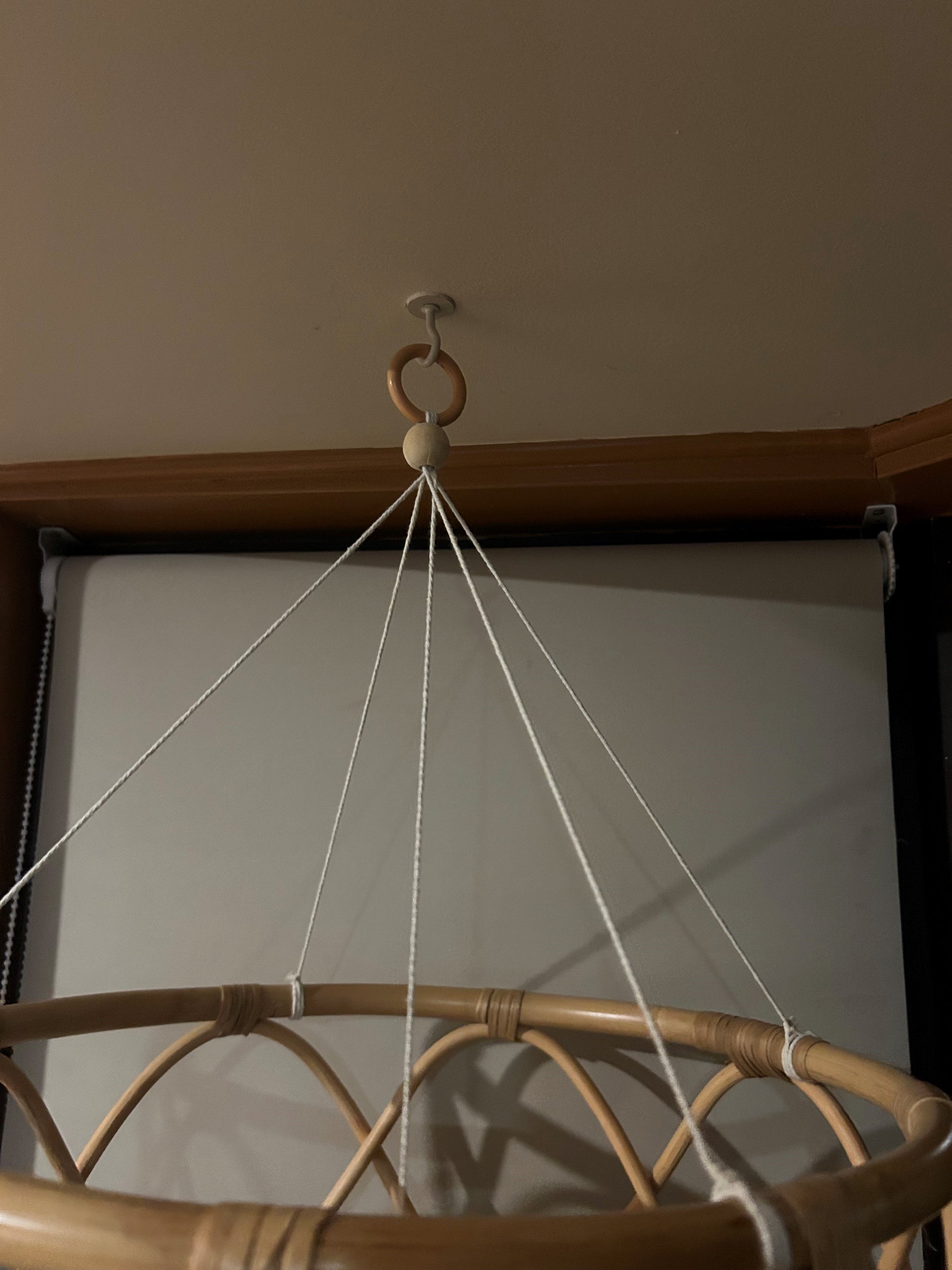 The rattan is drawn together with a strong cotton string and finished with a wooden bead and wooden ring to link onto a hook