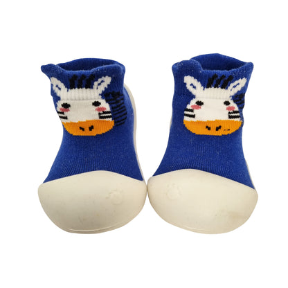 A pair of blue baby socks with a white giraffe design and a blue firm sole.