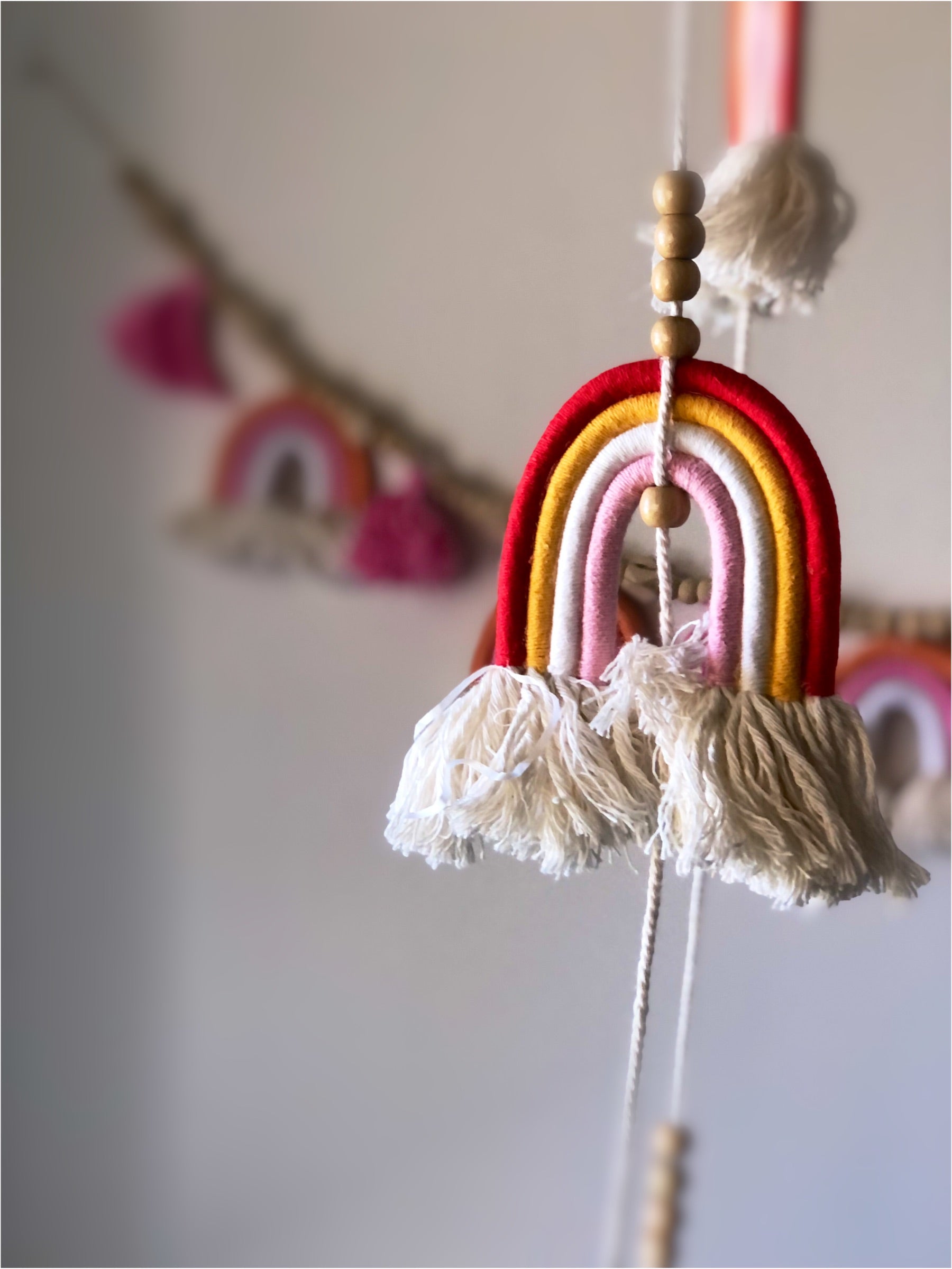 Handmade long macrame rainbow baby mobile, boho nursery decor and unique baby gift Australia.